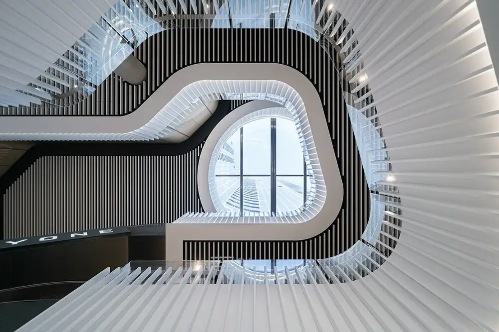 A painter reaching for new heights on a modern building