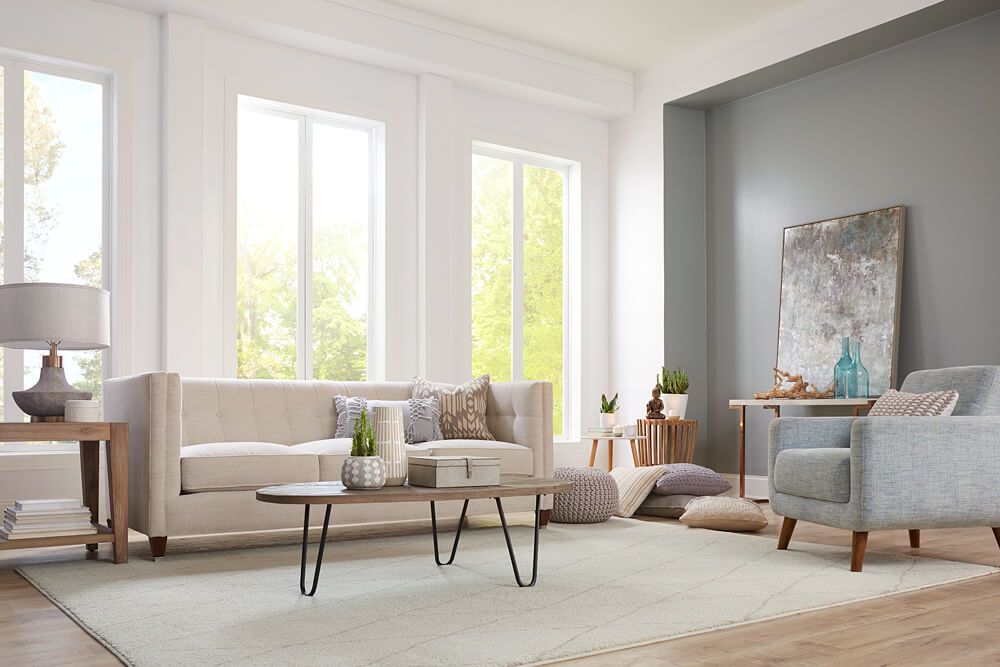 A living room with dated, yellowing walls