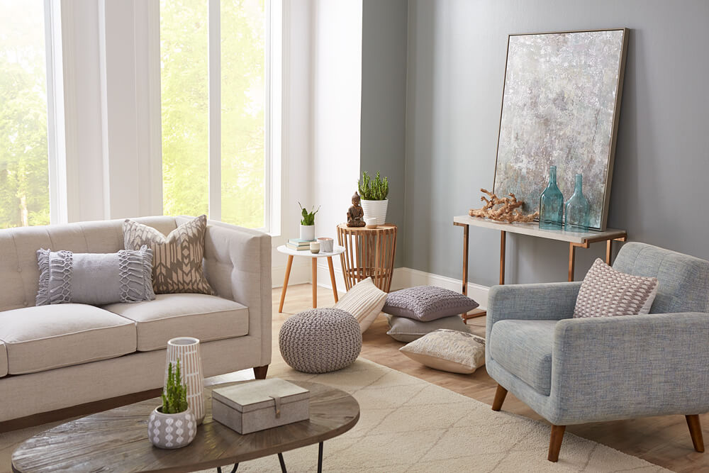The same living room, beautifully transformed with fresh grey paint