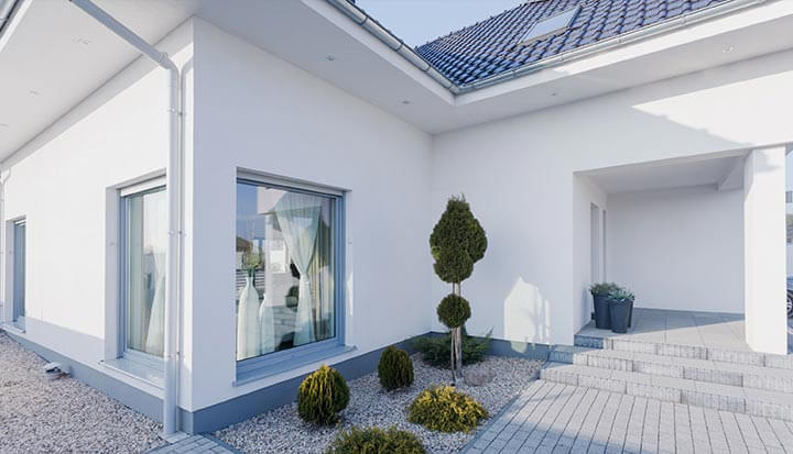 A beautiful modern house with a pristine white exterior paint job