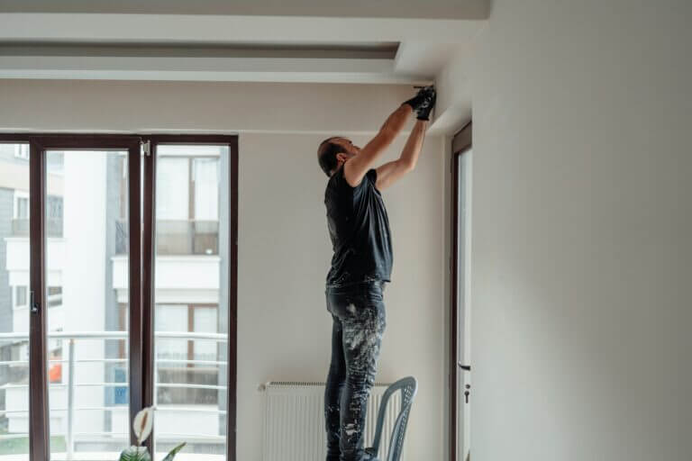 A team of painters working efficiently and safely in a commercial space